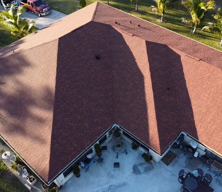 aerial view of a newly installed red shingle roof